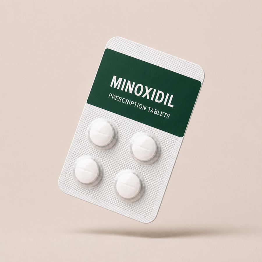 Minoxidil prescription tablets in a forest green blister pack